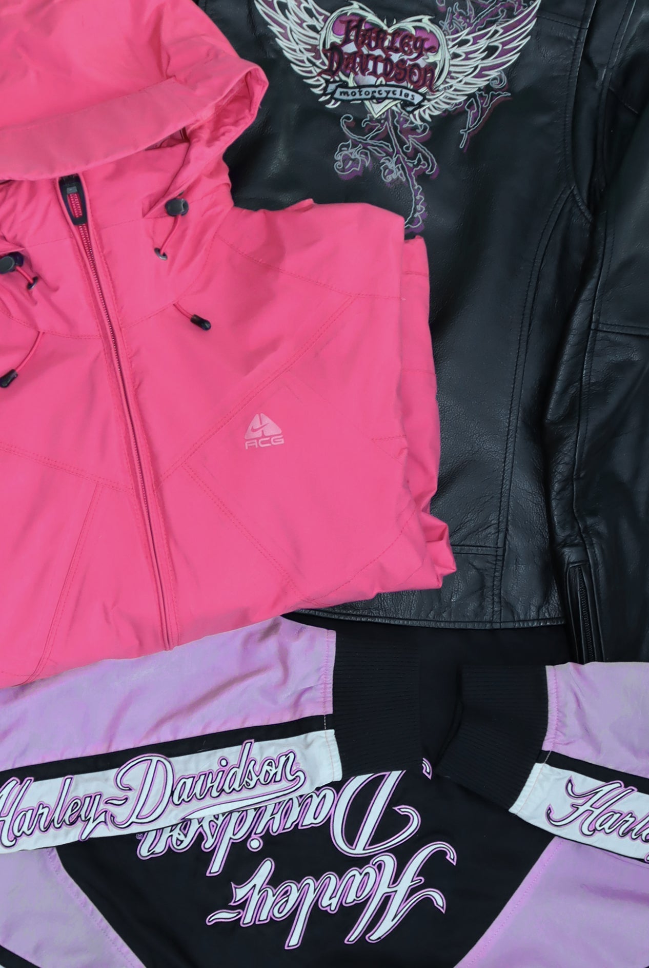 Womens Vintage Leather And Sportswear Jackets Close Up Flat Lay